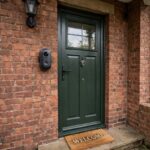 Retrofit smart lock fitted on a flat front door in a UK apartment hallway