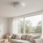 Best smart smoke and CO detector 2026 mounted on the ceiling of a modern living room